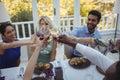 Friends toasting wine glasses in restaurant Royalty Free Stock Photo