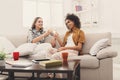 Friends toasting with wineglasses at home Royalty Free Stock Photo