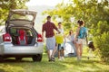 Friends unpacking car for camping Royalty Free Stock Photo