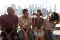 Friends Visiting New York With Manhattan Skyline In Background