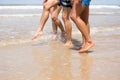 Friends walking along the beach Royalty Free Stock Photo