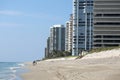 Friends walking along Singer Island beach front condos Royalty Free Stock Photo