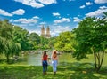 Friends walking in beautiful park on summer day. Royalty Free Stock Photo