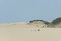 Friends walking on Fortaleza beach Brazil.