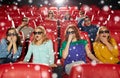 Friends watching horror movie in 3d theater Royalty Free Stock Photo