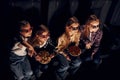 Friends watching movie together. Group of kids sitting in cinema Royalty Free Stock Photo