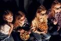 Friends watching movie together. Group of kids sitting in cinema Royalty Free Stock Photo