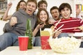 Friends Watching Television And Cheering Royalty Free Stock Photo