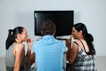 Friends watching tv Royalty Free Stock Photo