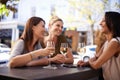 Friends, wine and women drinking at restaurant with laughing, bonding and relax outdoor in city for celebration. People Royalty Free Stock Photo