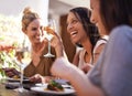 Friends, wine and women laughing at restaurant with drinking, bonding and relax outdoor in city for celebration. People Royalty Free Stock Photo