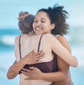 Friends, women and hug after exercise outdoor, happy and calm at the beach with love and fitness together. Support