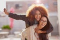 Friends, women and piggyback with energy outdoor, playful and fun for bonding, happiness and excited together. Cheers Royalty Free Stock Photo