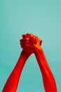 Friendship. Authentic hands gesturing  on cyan color background in red neon light. Concept of relationship Royalty Free Stock Photo