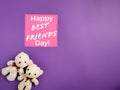 Friendship Celebration Concept - Happy best friend day text written on notepaper with teddies background. Stock photo