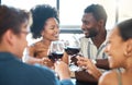 Friendship, celebration and luxury wine toast with a fun group at an event or restaurant, bonding and talking. Happy