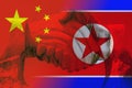 Friendship between China and North Korea with handshake