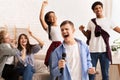 Friendship and home entertainment. Teens singing karaoke