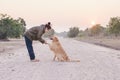 Friendship between human and dog - shaking hand and paw Royalty Free Stock Photo