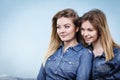 Two happy women friends wearing jeans outfit Royalty Free Stock Photo