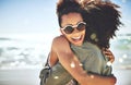 Friendship means everything to us. two girlfriends enjoying themselves at the beach. Royalty Free Stock Photo