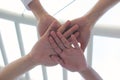 Friendship,Meeting teamwork concept,Group people with stack of hands showing unity on natural green background