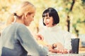 Friendship meeting. Trustful communication. Friendship or rivalry. Girls friends drink coffee talk. Conversation of two Royalty Free Stock Photo