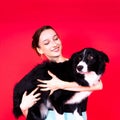 Friendship between people and animals, studio shot, love, tender, warm feeling and emotion