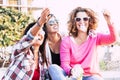 Friendship people concept with group of three young caucasian woman together having fun in playful outdoor leisure activity Royalty Free Stock Photo