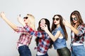 Friendship, people and technology concept - four happy teenage girls with smartphone taking selfie Royalty Free Stock Photo