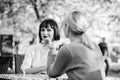Friendship or rivalry. Girls friends drink coffee talk. Conversation of two women cafe terrace. Friendship friendly Royalty Free Stock Photo