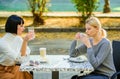 Friendship sisters. Friendship meeting. Female leisure. Girls friends drink coffee talk. Conversation women cafe terrace