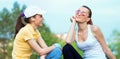 Friendship of smiling girl friends in sports clothing Royalty Free Stock Photo