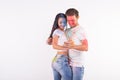 Friendship, social dance, love, festival of holi, people concept - young couple playing with colors and dancing bachata Royalty Free Stock Photo