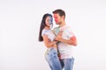 Friendship, social dance, love, festival of holi, people concept - young couple playing with colors and dancing bachata Royalty Free Stock Photo