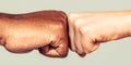 Friendship, team, good work. Multicultural friends giving fist bump to each other. Black African American race male and Royalty Free Stock Photo