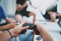 Friendship, technology, games and relaxing time at home concept - close up of male friends playing video games at living Royalty Free Stock Photo