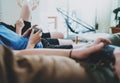 Friendship, technology, games and relaxing time at home concept - close up of male friends playing video games at living Royalty Free Stock Photo