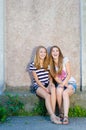Friendship - Two best girlfriends against grey background