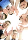 Friendship, youth and people concept - group of smiling teenagers with hands on top each other