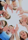 Friendship, youth and people concept - group of smiling teenagers with hands on top each other Royalty Free Stock Photo