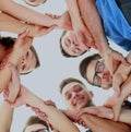 Friendship, youth and people concept - group of smiling teenagers with hands on top of each other. Royalty Free Stock Photo