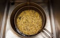 Fries in deep fryer at snack bar Royalty Free Stock Photo