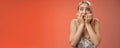 Frightened afraid panicking young cute blond woman biting nails pop eyes scared camera look terrified stunned speechless Royalty Free Stock Photo