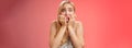 Frightened afraid panicking young cute blond woman biting nails pop eyes scared camera look terrified stunned speechless Royalty Free Stock Photo