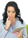 Frightened Anxious Cautious Young Hispanic Woman Using Wireless Tablet Royalty Free Stock Photo