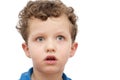 Frightened face of a boy on a white Royalty Free Stock Photo