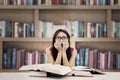 Frightened student in library Royalty Free Stock Photo