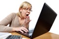 Frightened woman with glasses looking at laptop isolated Royalty Free Stock Photo