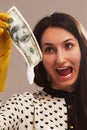 Frightened woman launder shady money (illegal cash, dollars bill Royalty Free Stock Photo